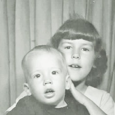 Brent and Cindy in an instant photo booth (1965).