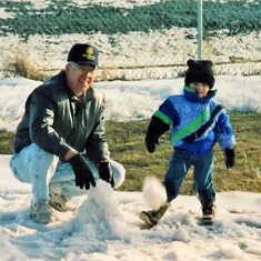Grandpa teaching Sam how to throw a snowball (1993).