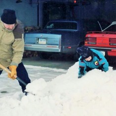 Darrel & Sam interacting with snow at the Fargo townhome (1993).
