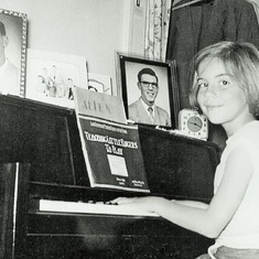 Karen learning to play piano, June 1955.  She later gave piano lessons to Arvin's daughter, Cindy.