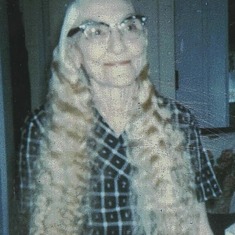 Julia Drinkwine in a rare photo with her hair down.  Instead of white, grey or silver, it was golden-straw colored.  She usually wore it in two braids wrapped around her head.