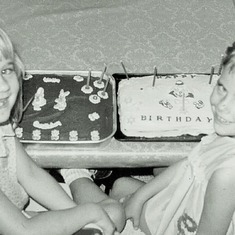 Debbie & Sheila Hagen, 1969, in Grenora, ND.  Their Grandma Hazel Hagen made each of them a birthday cake.