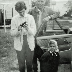 One of Arvin's aunts and her family - Marilyn, Francis (called "Fats") and Shari McKenzie, 1969, in front of the Grenora, ND, home.