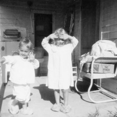 Arvin's nieces - Sheila and Debbie Hagen - 1966 in front of the Grenora, ND, house (brother Charles' daughters).