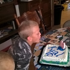 Kial blowing out his candles
