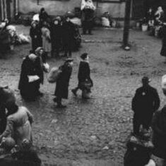 Jews carrying bundles of possessions before their deportation from the Kovno ghetto. Kovno, Lithuania, October 1943