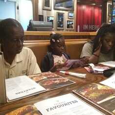 Aubrey and his goddaughters at Fridays Trinidad