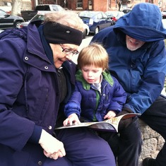 Alice and Aubrey reading to grandson Eli, Philadelphia, 2011