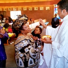 Aunty receiving the Eucharist in Canada.