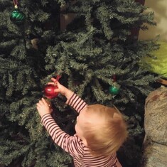She helped us decorate the tree the Christmas after her first birthday. 