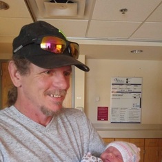 My dad with Avavin the day after she was born.