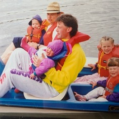 Ave and my dad (Mark) taking us for a paddleboat ride - Laurenne & me back, Paul & Carleen front