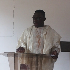 Pastor Bankole preaching in the church in Nigeria