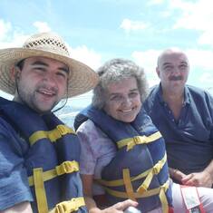 Barb parasailing with Tony and her grandson, Anthony Jr.
