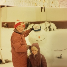 My mom and me with the Snowman we built 
