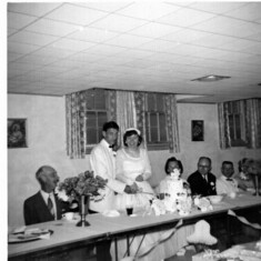 Grandpa Nelson and my Grandma and Grandpa Winchell watching mom and dad cut their cake.