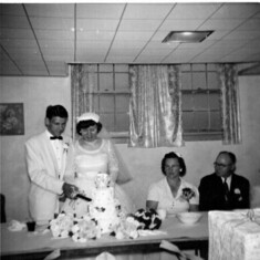 Cutting the cake with Grandma and Grandpa Winchell present.