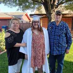 Tatum on graduation night with her Papa and Gramma Erwin