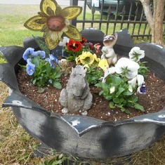 My planter out front filled with flowers of the season.