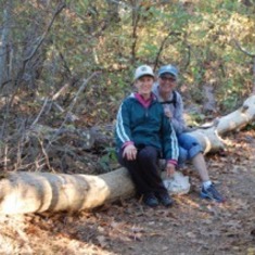 Barbara and Maureen Nolan resting (and smiling) together on a beautiful Fall hike