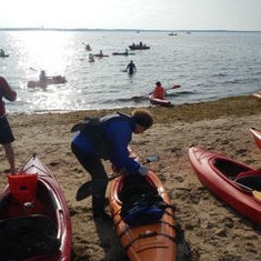 Barbara getting into her kayak (in the early, early morning hours) last summer to row beside her friend Maureen Nolan in an open water swim (The annual "Save Buzzards Bay" fundraisier)