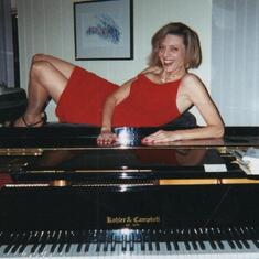 Barb posing on the piano in Bellevue WA