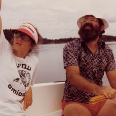 Ev and Barry in our sailboat on the Duplin River by Sapelo Island. Ev is wearing a Kibbutz Amiad t-
