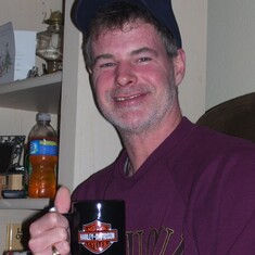 Barry getting a Harley cup for Christmas 2009.