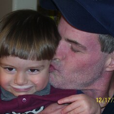 Uncle Barry giving Ryannator a sloppy kiss - now Ryan is smiling!