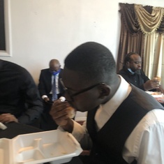 Grandson of the deceased at funeral 