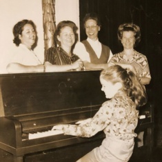 With Joann Bounds, Maisy Donaghey and Mrs Boscamp; Jolinda playing piano