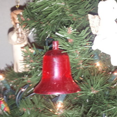 Mom and Dad's first Christmas Ornament.... is on her tree every year !
