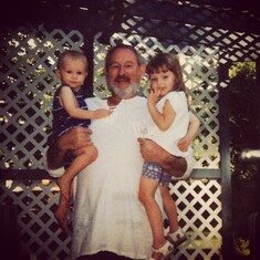 Dad holding Abbie & Stephen when they were little.