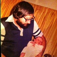 Dad holding Kate when she was 3 days old!