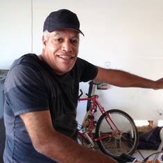 Getting ready to work on his motorcycle and bicycle