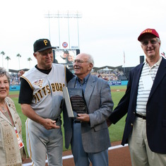Coach Arce accepts award from Jim Colborn, then the pitching coach for the Pirates. Nancy Arce and Andy Van Horn look on.