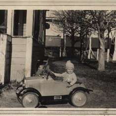 Billy Couch at about two or three (1930-1931) - his first car!