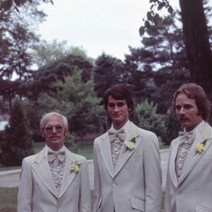 Jim and Lynne's wedding. Photo is entitled "Three Hairs Two Moustaches and a Midget."