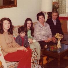 This was taken of my family  in December of 1976. My mom and dad, me , my nephew and my older sister