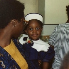 Bisi at jide’s Naming ceremony in August 1990 carrying Wande Babalola 