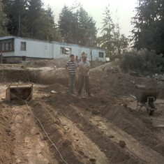 Bobby and Jim (Dad); digging area to lay concrete for new house