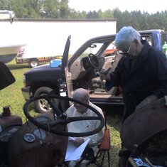 09-03-12
Dad (Joe) and Bob working on their tractors.  this one had a nasty electrical problem.