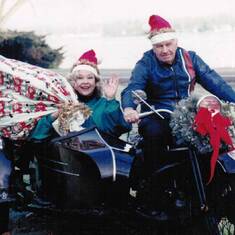 Are we having fun yet?  (Santa's Elves in a 1939 Harley with sidecar).  One more delivery left, Ma?