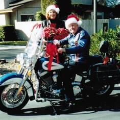 Mr. and Mrs. Kris Kringle, getting ready for a Christmas Ride on their Softail Sleigh!