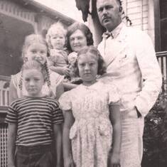 Front Row: Bob and his sister, Peggy.  Back Row:  Sisters Mary Jane and Dotty, Mother (Alice) and Dad (Dr. Leif).