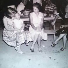 Mama holding Mark Porch in 1964 with Aunt Virginia sitting next to them on the bench