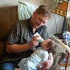 Brad feeding his baby Eric Hunter Wetzel. He was so proud.
