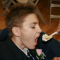 Best man Brady eating cake at Cory and JoJo's reception. May 24,2008.