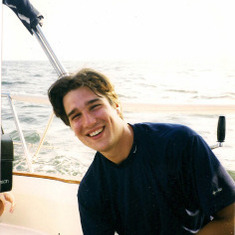 Branden on the family's boat, The Flora (1999)