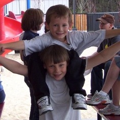 Brandon carrying Preston on his shoulders. 